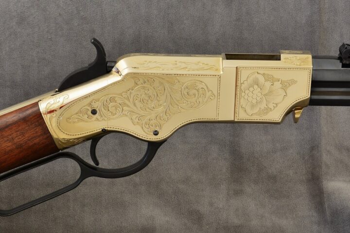 The engraving design is inspired by a historic Henry rifle in the Cody Firearms Museum collection.