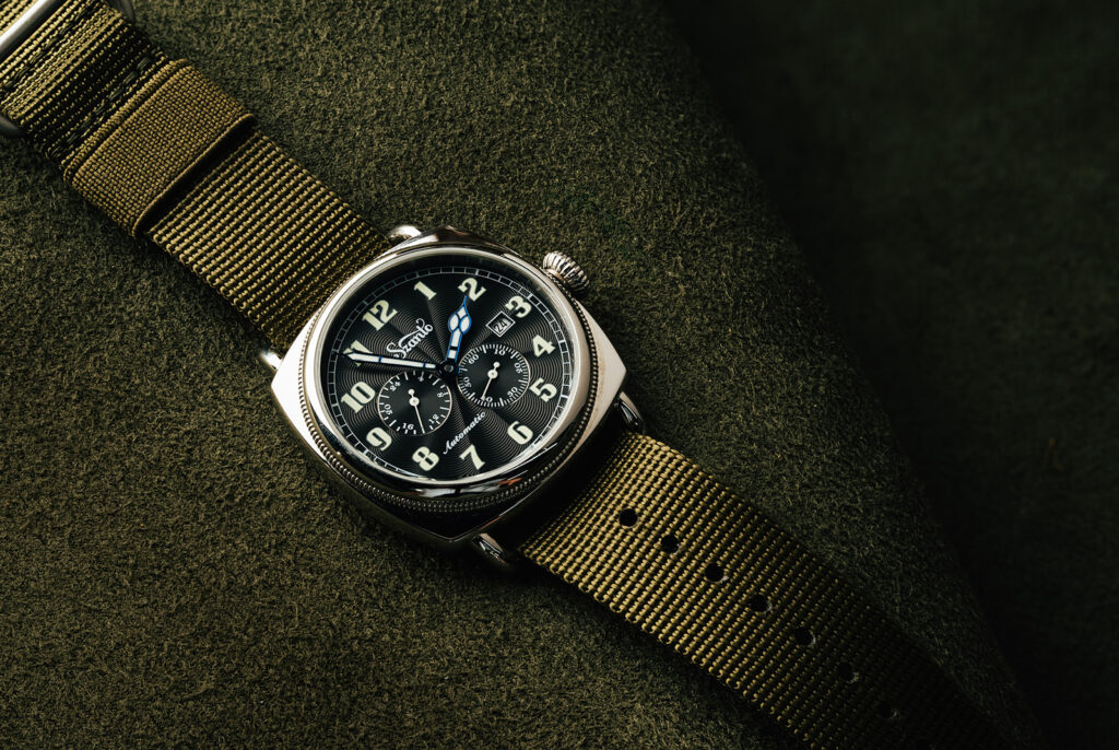 The Officer Coin Cushion case has been a staple of watch style, specifically military watches, for around 100 years; notable cushion-case watches include the Rolex 3139, the Oyster Army, which was produced for the Allies during WWII, and the Panerai Radiomir, used by the Italian Navy as early as 1936. While some versions of the cushion case have remained in production for decades, the style saw a resurgence in the late 60s and early 70s with watches like the Heuer Camaro and Seiko Monaco.