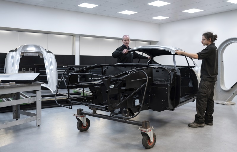 Two men installing roof on DB4 GT Zagato Continuation