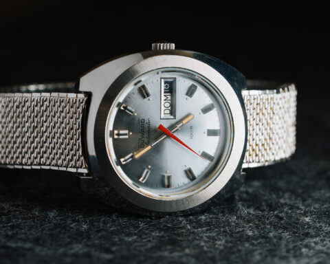 1970s Duward Automatic 100M Internat stainless steel watch with silver dial and Spanish day wheel