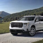 We review the 2026 GMC Acadia Denali Ultimate AWD, a 328-hp three-row luxury SUV with Super Cruise, massaging leather seats, AWD, and room for seven.