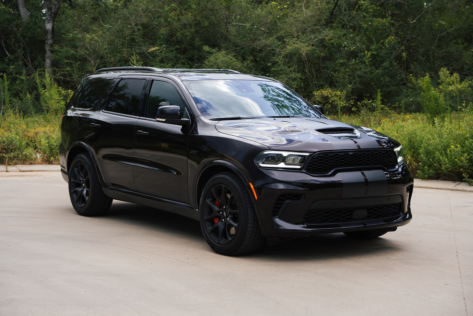 The 2026 Dodge Durango R/T 392 Blacktop combines a 475-horsepower HEMI V8, three-row seating, AWD, and 8,700 pounds of towing capacity.