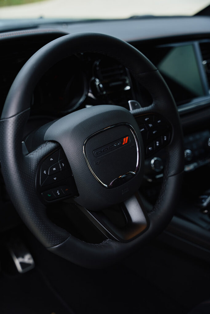 The 2026 Dodge Durango R/T 392 Blacktop combines a 475-horsepower HEMI V8, three-row seating, AWD, and 8,700 pounds of towing capacity.