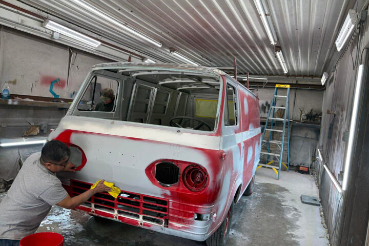 The 1962 Ford Econoline Bulova Racing van is stripped for restoration at Apex Auto Works, revealing minor hidden damage but an exceptionally solid body ready for paint.
