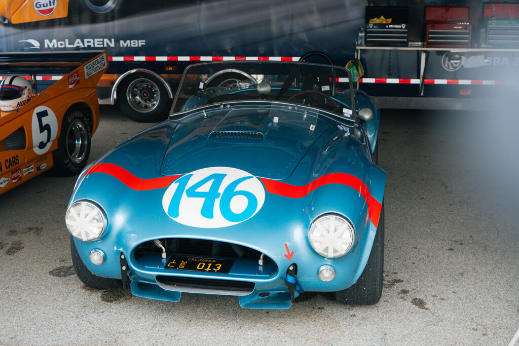 Dan Gurney and Jerry Grant drove Shelby Cobra CSX2323 to eighth overall and a class victory at the 1964 Targa Florio. In 2026, the historic FIA roadster was still racing at the Rolex Monterey Motorsports Reunion.