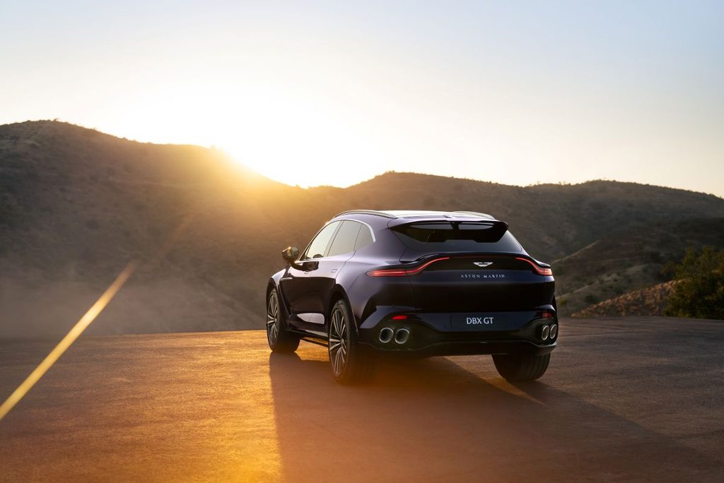 Aston Martin DBX GT parked on a scenic overlook.